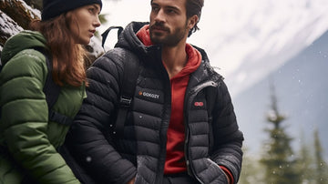 A man and woman wearing GOKOZY heated jackets in a snowy forest