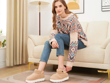A lady wearing heated slippers for warmth and comfort.