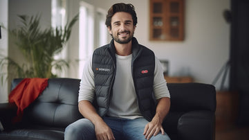 Man in a room wearing a Gokozy heated vest